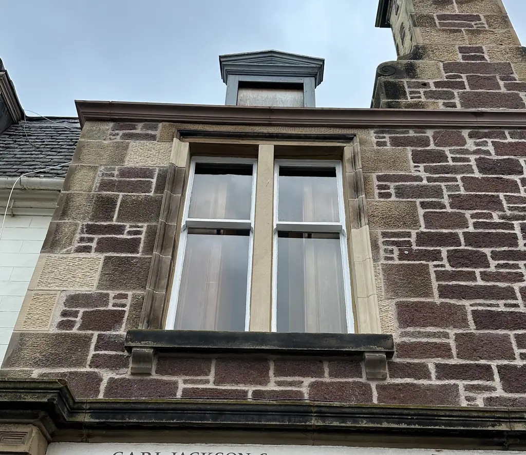Sandstone window and dormer on a stone frontage at The Square, East Linton