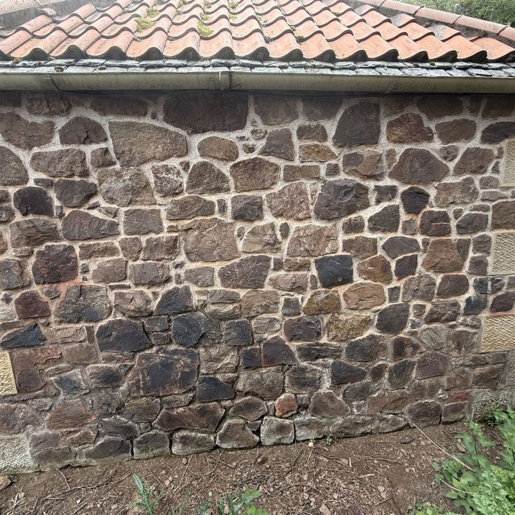Stone wall before a new window opening was formed